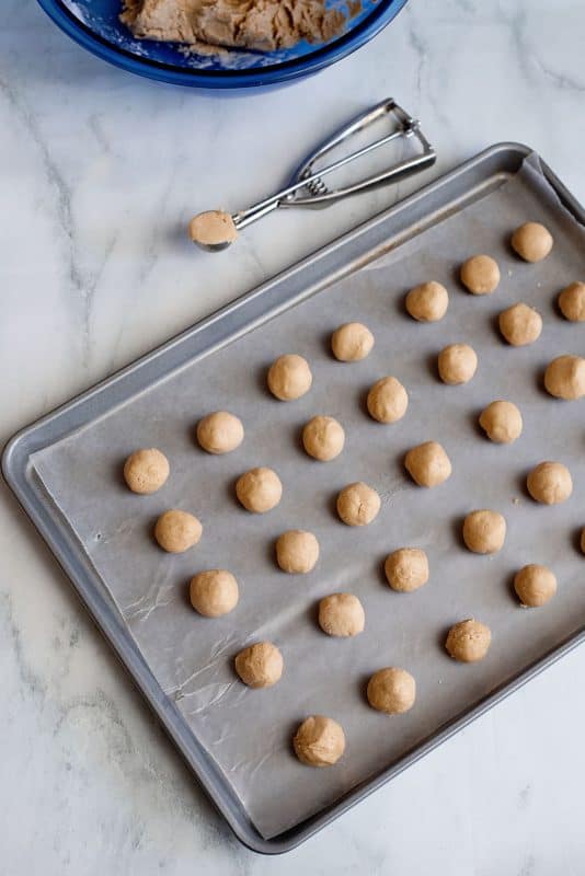 Balls of dough on baking sheet.