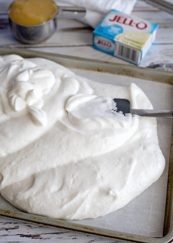 Pour cake batter onto prepared baking sheet.