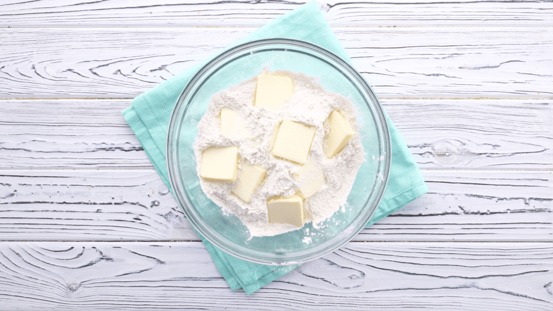 Add cold butter to mixing bowl.