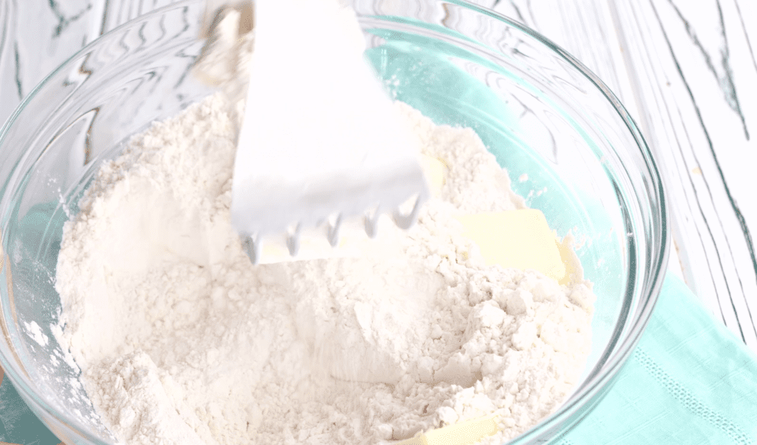 Cut together butter and flour with pastry cutter.