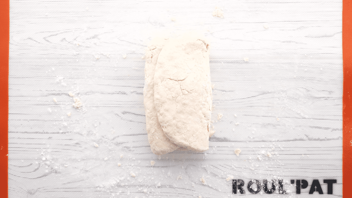 Fold both sides of dough into middle.