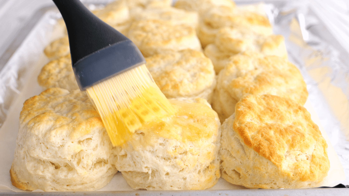 Brush buttermilk biscuits with melted butter.