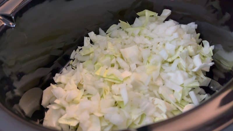 Layer in cabbage and onion in crockpot