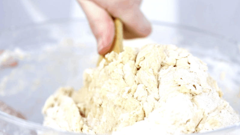 mix the flour into the challah with honey dough.