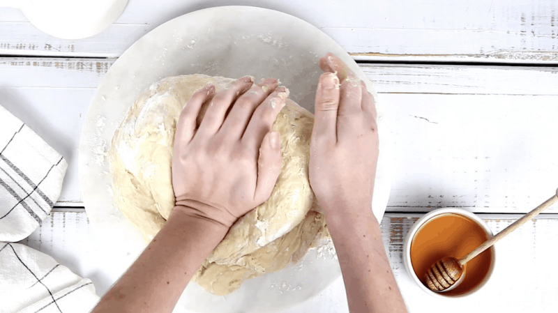 knead challah dough on floured surface for 10 minutes.