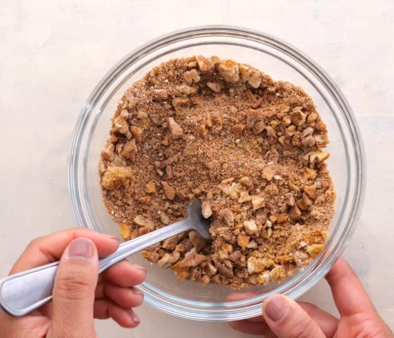 Mixing streusel mixture in bowl