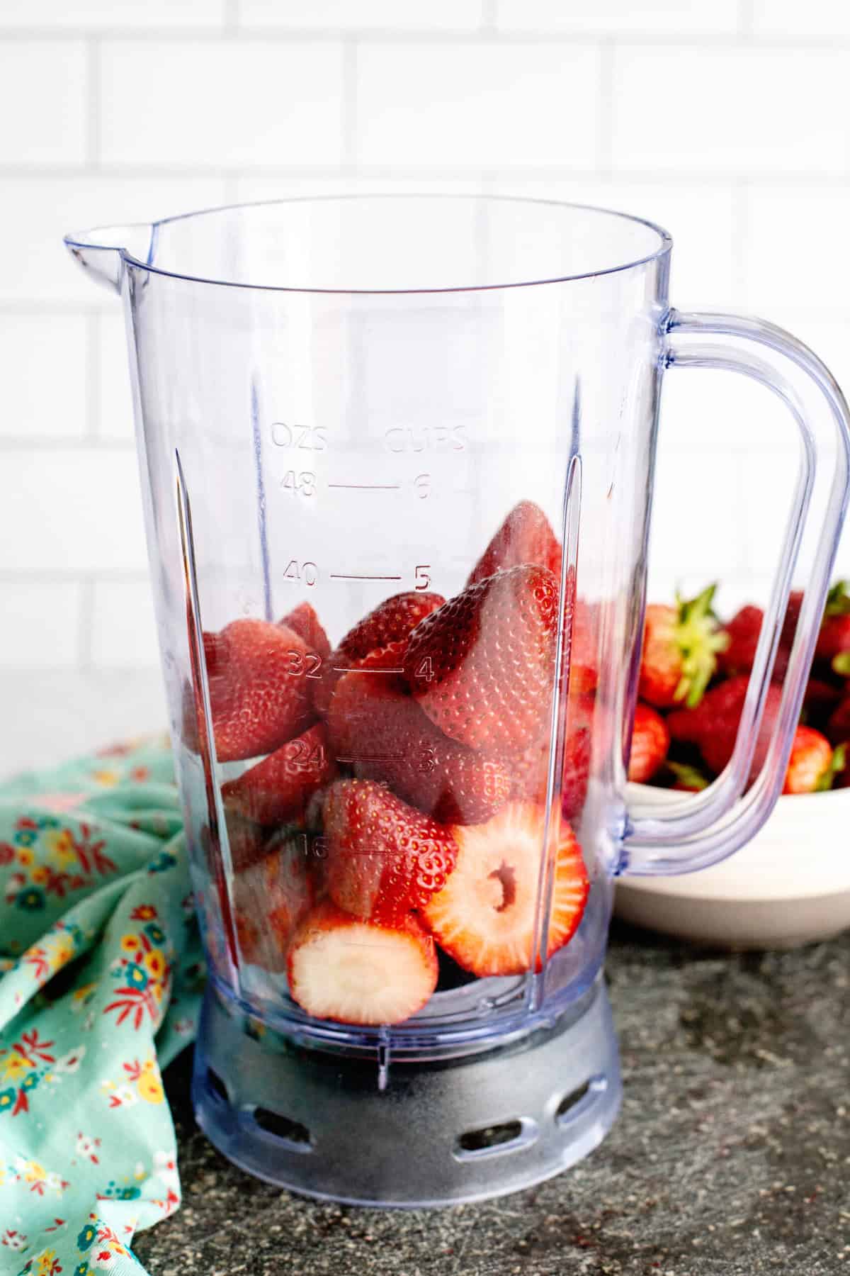put strawberries into the blender