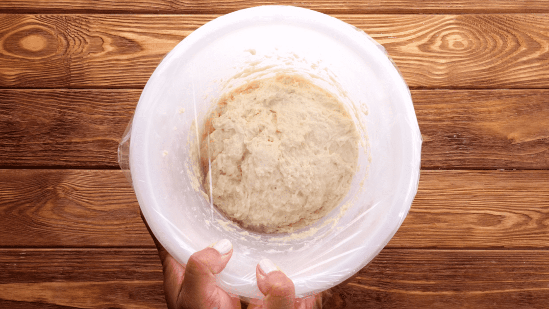 Cover bowl with plastic wrap.