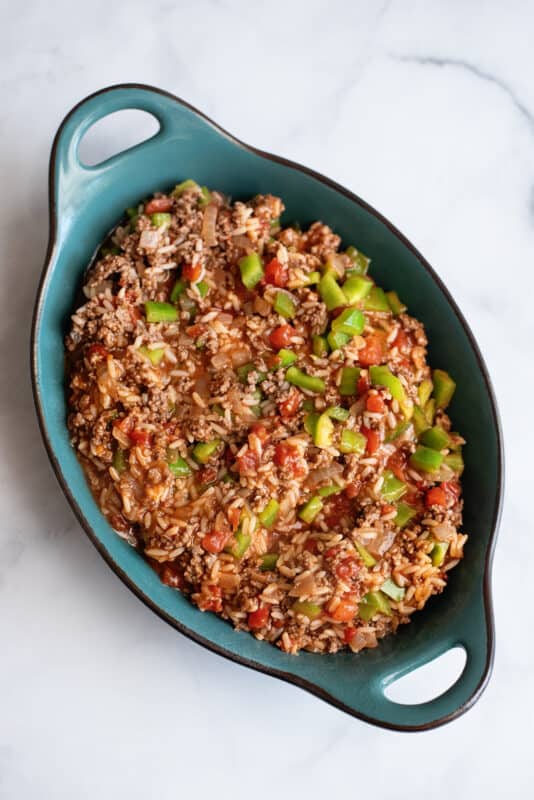 spoon the stuffed pepper casserole into a casserole dish