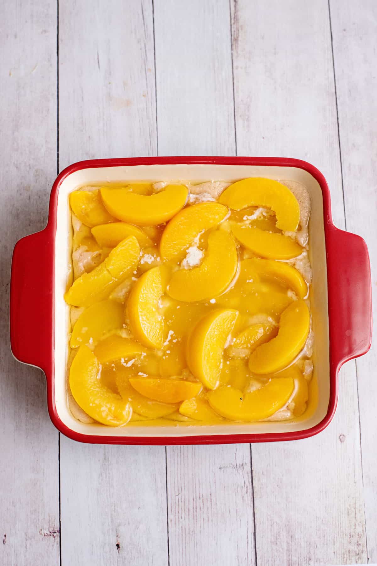 Arrange peaches on top of batter.