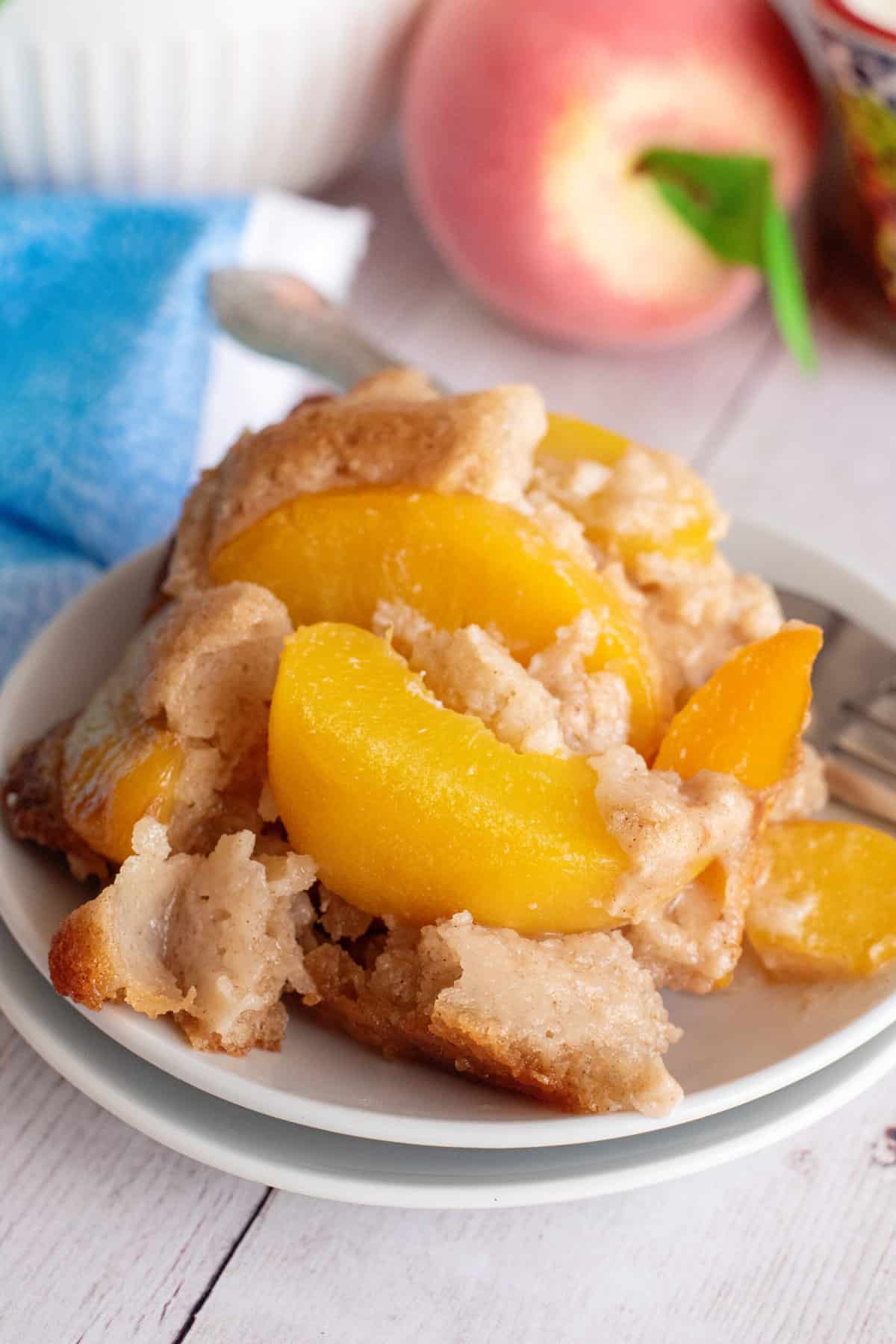 Serving of old-fashioned peach cobbler.