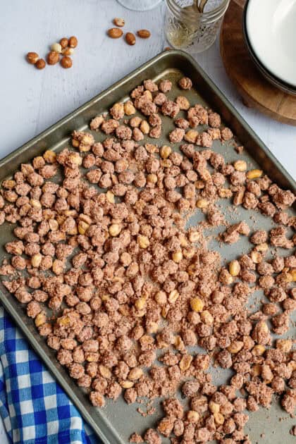 Candied peanuts spread on a cookie sheet.
