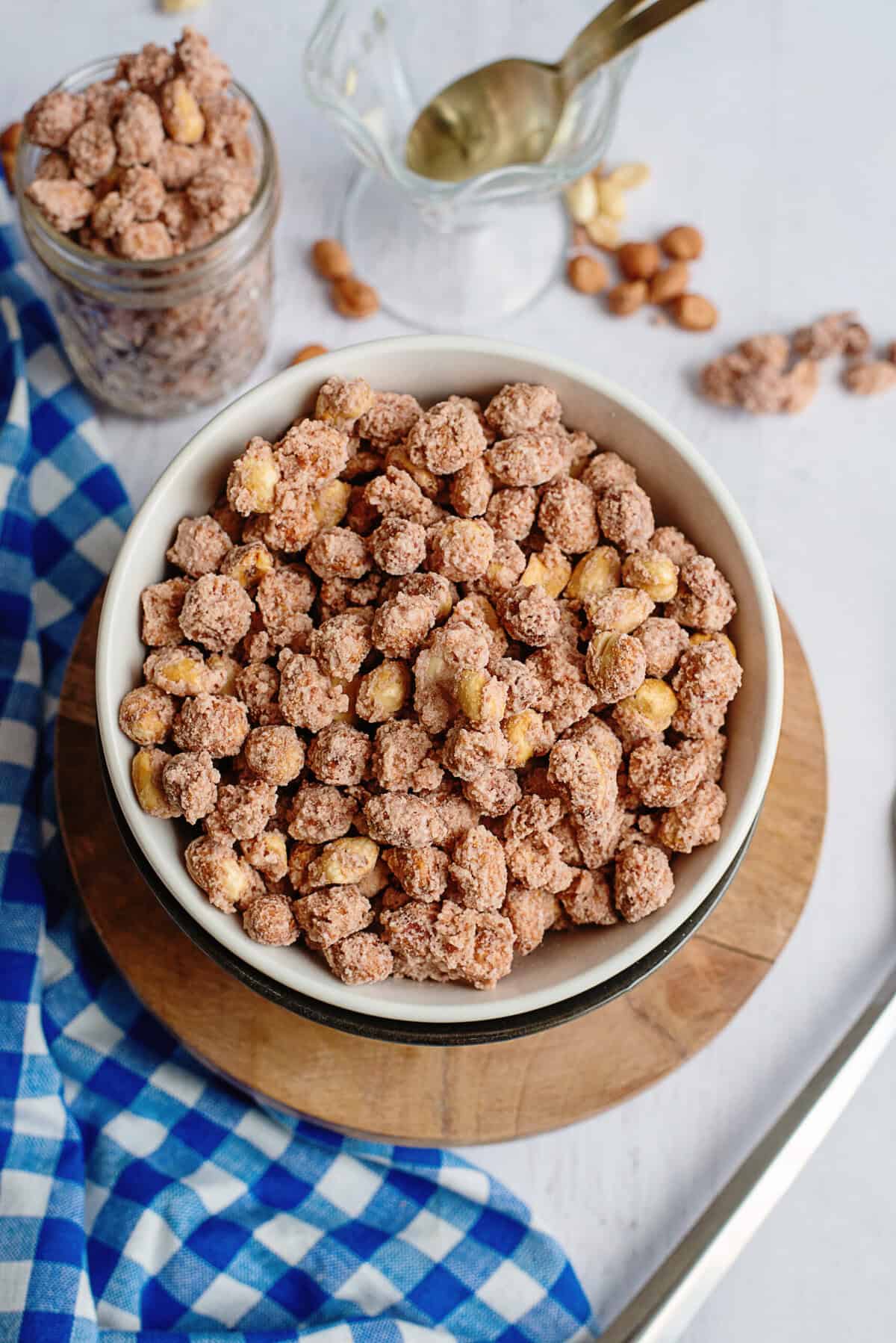 Candied peanuts in a white bowl.