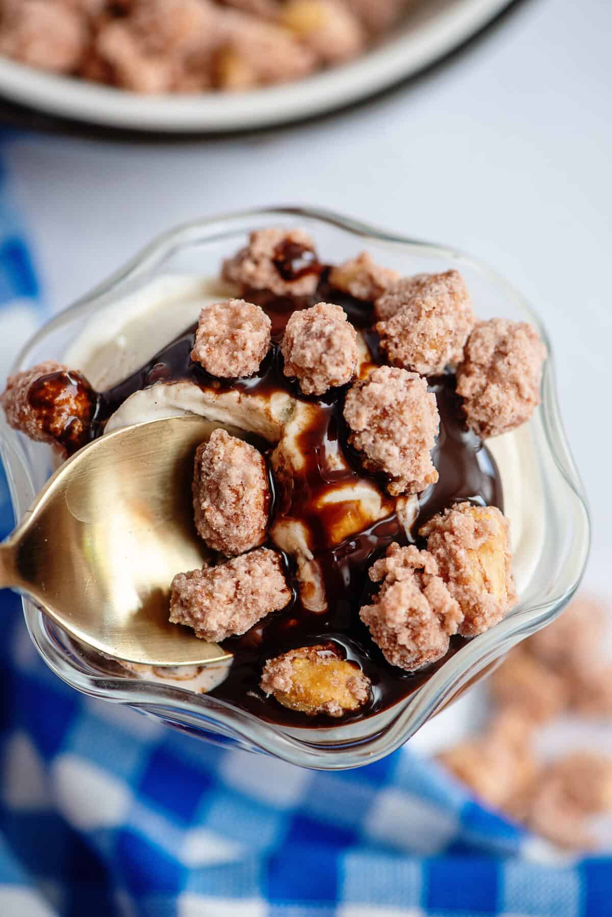 Close-up of candied peanuts on an ice cream sundae.