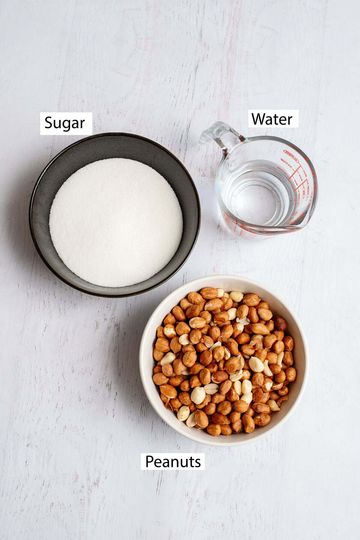 Ingredients for candied peanuts include raw peanuts, water, and white sugar.