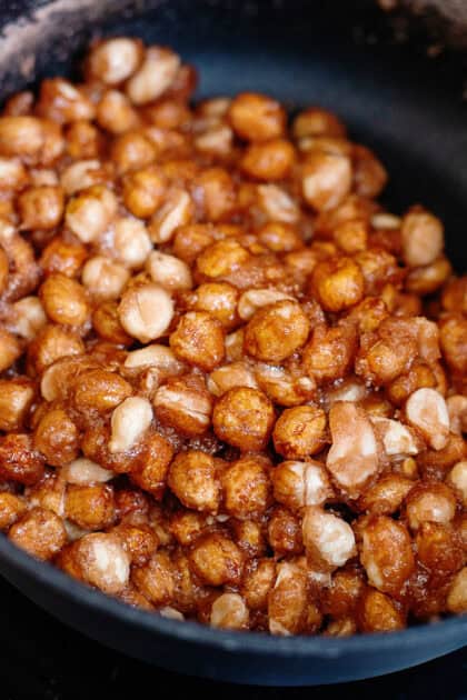 Boiled peanuts in a black pot.