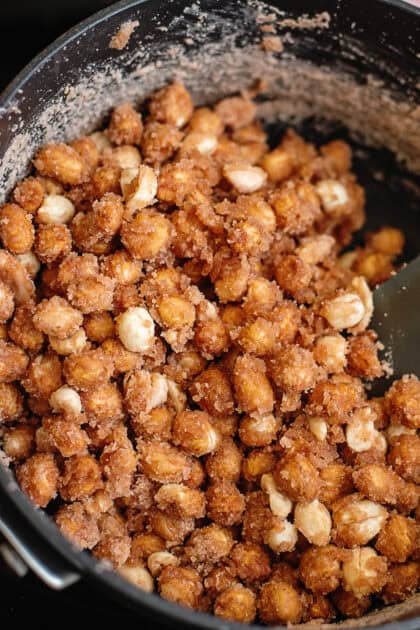 Close-up of boiled peanuts in a black pot.