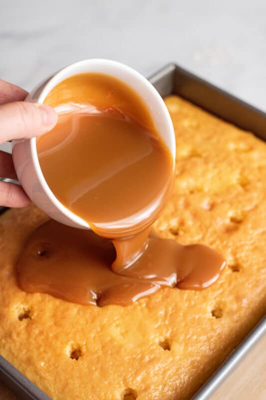 let cool and spread caramel over milk cake