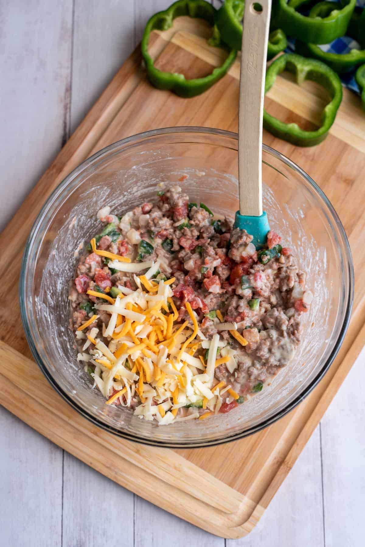 Fold Colby Jack cheese into mixing bowl.