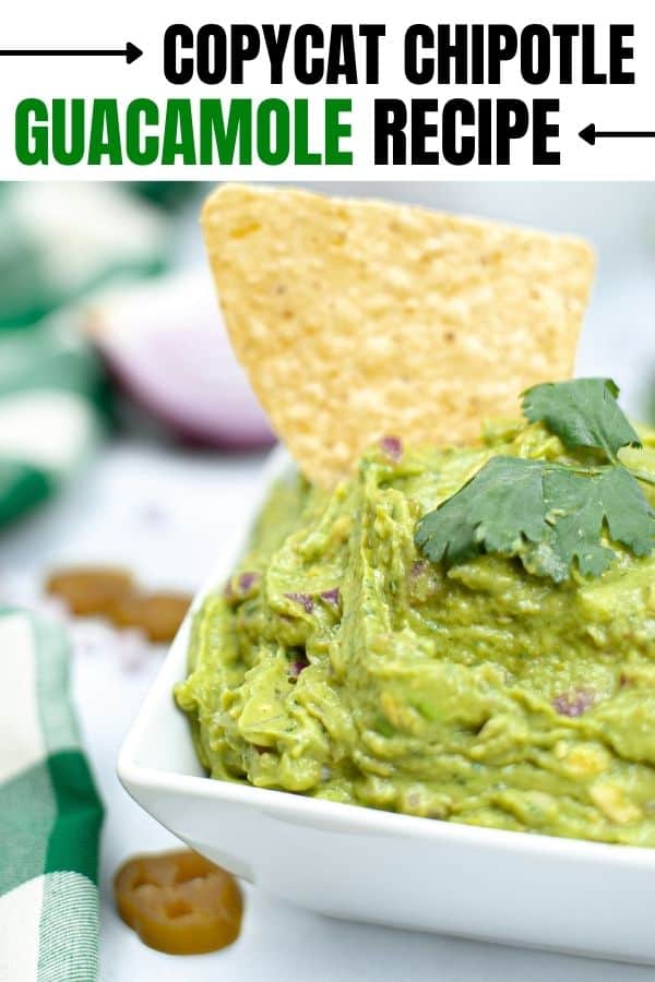 guacamole with chip in it on table