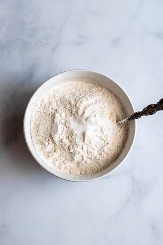 In small bowl whisk together flour and salt