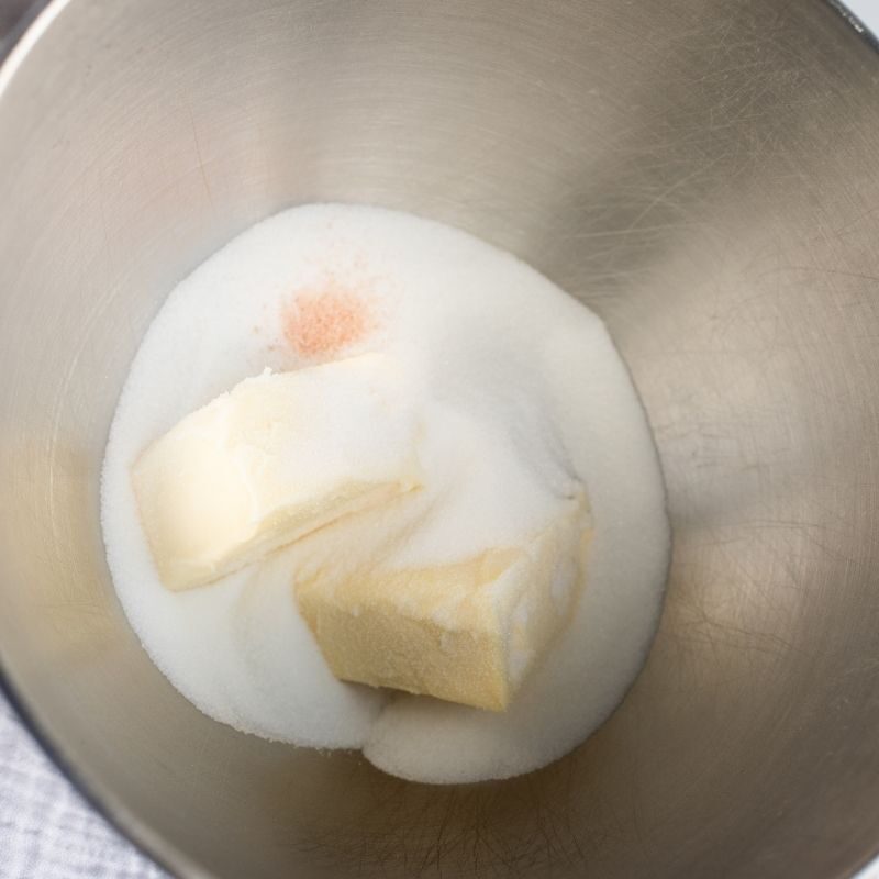 Cream together butter and sugar in separate mixing bowl.