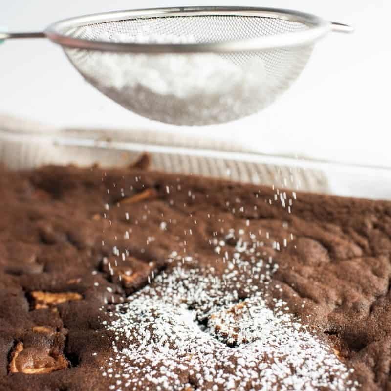 Dust brownies with powdered sugar.
