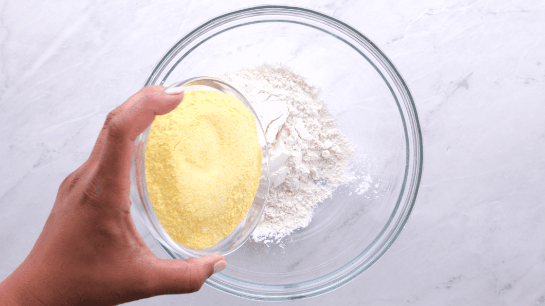 Add cornmeal to mixing bowl.