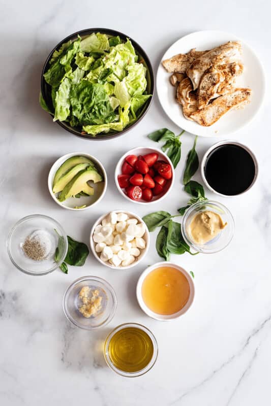 Caprese salad ingredients, lettuce, balasamic, honey, garlic, olive oil tomatoes, mozzarella, chicken, avocado