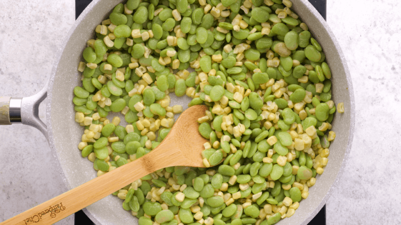 Corn and lima beans in skillet.