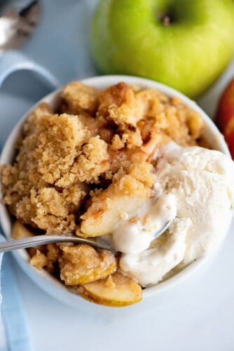 Apple crisp and scoop of vanilla ice cream