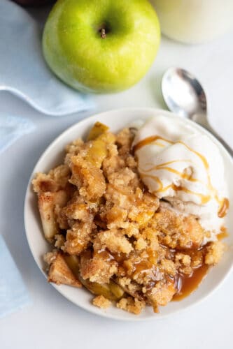 Apple crisp and scoop of vanilla ice cream