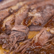 Close-up on slices of beef brisket.