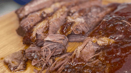 Close-up on slices of beef brisket.
