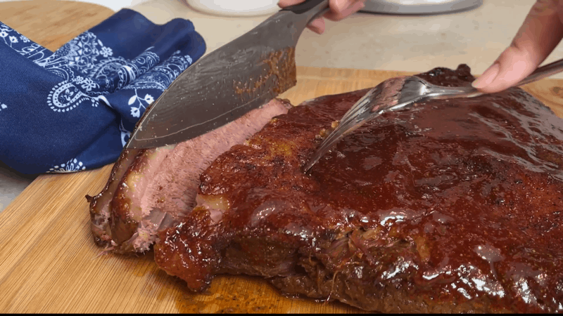 Cutting slices of beef brisket.