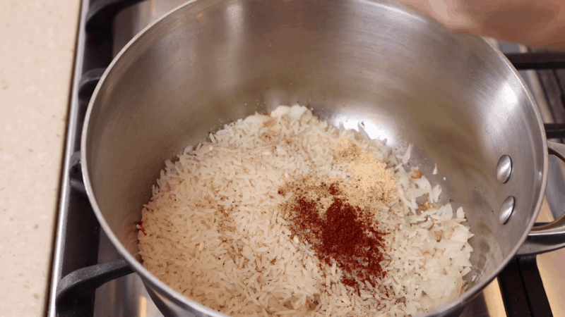 Rice and spices in large pot.