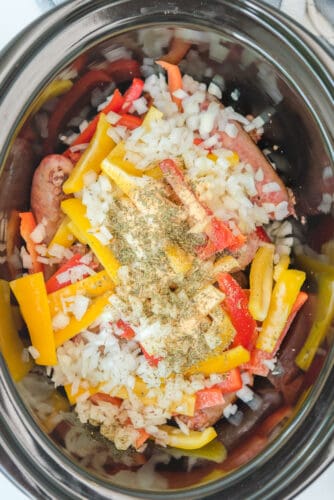 All ingredients for sausage and peppers in crockpot.