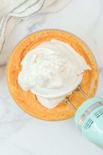Add whipped topping to pumpkin cream cheese mixture.