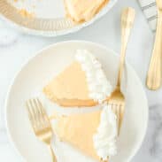 Two slices of no-bake pumpkin cheesecake on plate.