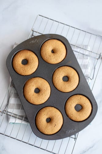 Donut tray of baked donuts.