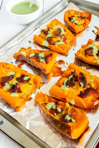 Sweet potato skins drizzled with basil sauce.