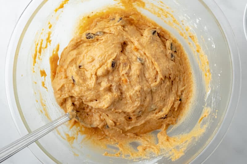 Mix walnuts and raisins into batter.