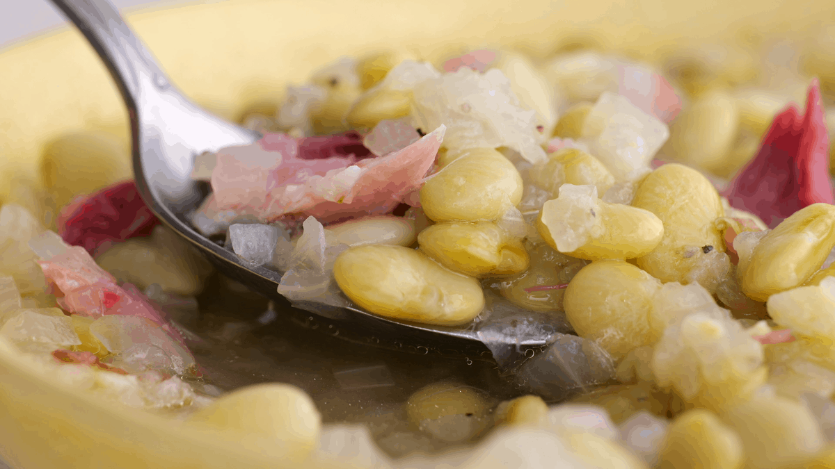 Spoonful of butter beans and ham.