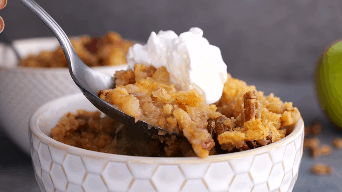 Spoonful of apple crumble.