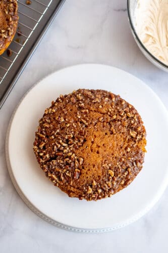 Cake, praline side up, on serving plate.