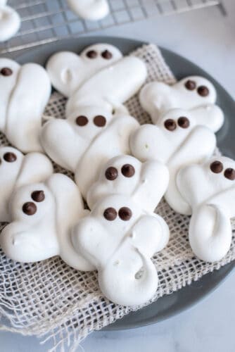 Plate of ghost meringue cookies.