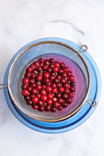Drain cranberries from syrup.