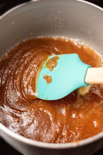 Melt topping in saucepan.