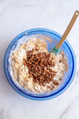 Add pecans to mixing bowl.