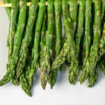 Close-up of grilled asparagus on plate.